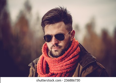 Young Man With Scarf And Sunglasses In Winter