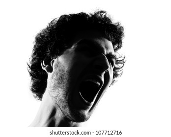 Young Man Screaming Angry Portrait Silhouette In Studio Isolated On White Background