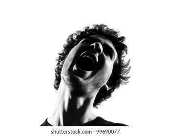 Young Man Screaming Angry Portrait Silhouette In Studio Isolated On White Background