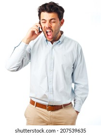 young man screaming to cellphone on a white background