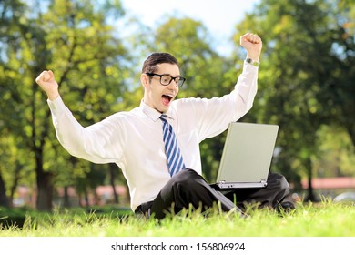 Young Man Screaming And Watching TV On A Laptop In A Park Outside