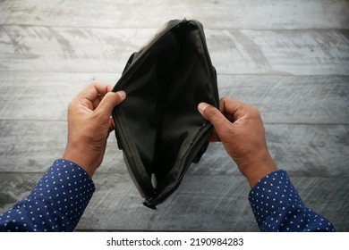 Young Man Searching Something In A Shoulder Bag 