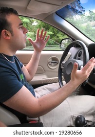 A Young Man Seems To Be Experiencing Some Road Rage While Driving.