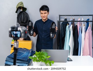 Young Man Selling Shoes And Clothes Online By Camera Live Streaming, Business Online E-commerce At Home