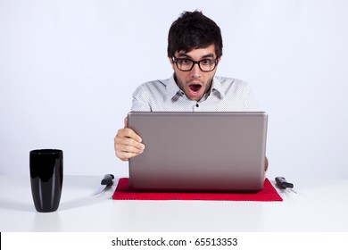 Young Man Shocked With Something He See On His Laptop Computer