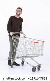 Young Man With A Shopping Cart Steps Forward