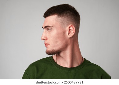 Young Man With Short Hair Looking To The Side - Powered by Shutterstock