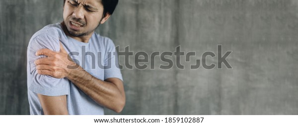 Young Man Shoulder Pain Banner Background Stock Photo 1859102887 ...