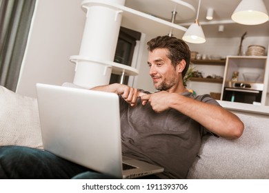 Young Man Showing Gesture In Sign Language Using Laptop, Make Video Call.