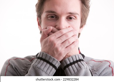 Young Man Showing He Can't Speak (hands On Mouth)