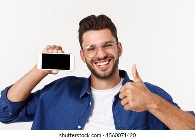 Young Man Showing His Brand New Smart Phone Isolated On White.