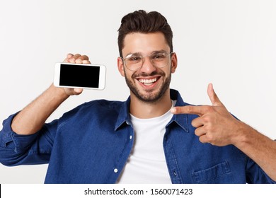 Young Man Showing His Brand New Smart Phone Isolated On White.