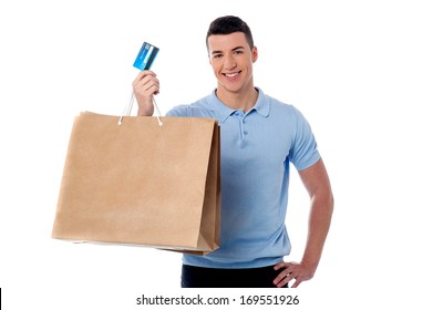 Young Man Showing His Shopping Bag And Credit Card