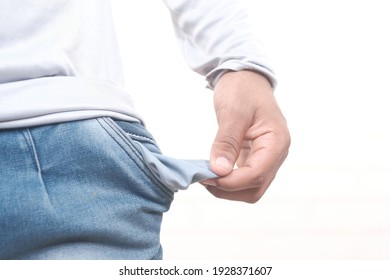 Young Man Shows Empty Pant Pocket With Copy Space 