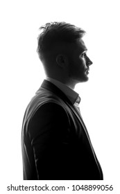 Young Man Silhouette In Suit Profile On A White Isolated Background.