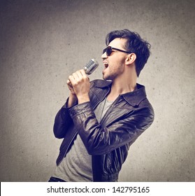 Young Man Singing With Microphone