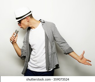 Young Man Singing With Microphone