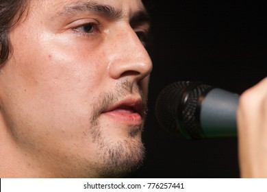 Young man singing in the studio