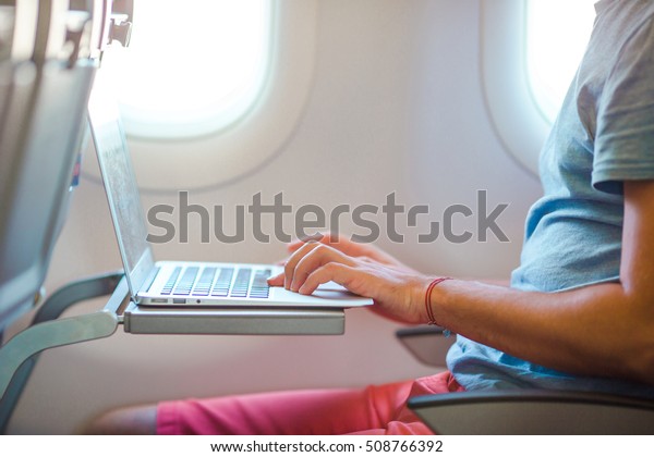 Young Man Sitting Airplane Working On Stock Photo (Edit Now) 508766392