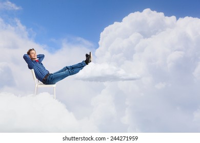 Young Man Sitting In Chair With Legs Up And Relaxing