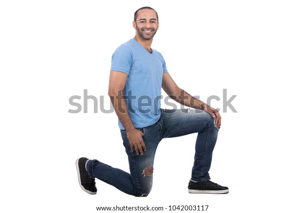 Young Man Sitting On One Knee | People Stock Image 1042003117