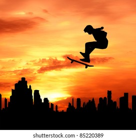 Young Man Skateboarder Jumping Over The City During Sunset Silhouetted, Extreme Sport