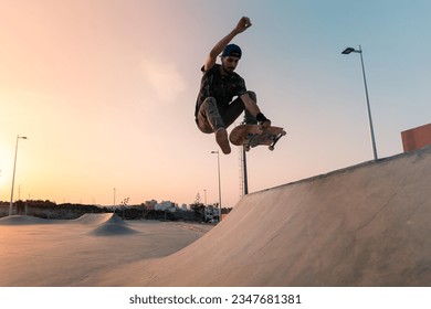 young man skates in a skate park at sunset y Gran Canaria. Canary Islands - Powered by Shutterstock