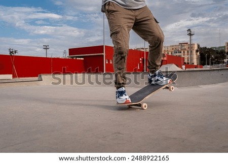 Similar – teenager practicing with skateboard at sunrise city