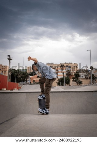 Similar – teenager practicing with skateboard at sunrise city