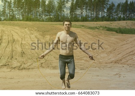 Similar – sports guy in his underwear looking at the river