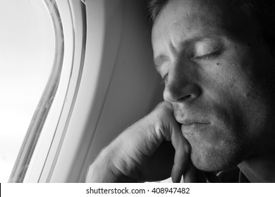 Young Man Sleeping In The In Airplane.
