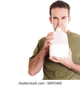 A Young Man Smelling A Container Of Spoiled Milk, Isolated Against A White Background