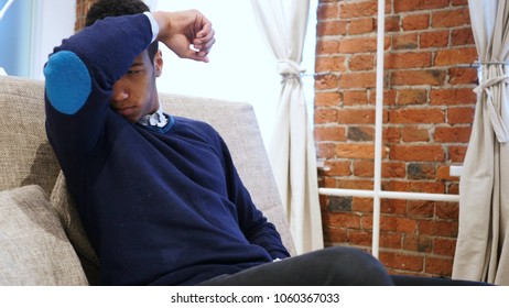 Young Man, Smelling Sniffing His Armpit, Stinks Bad, Foul Odor