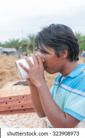 Young Man Sniffing Glue..Selective Focus. Very Shallow Depth Of Field, For Soft Background.