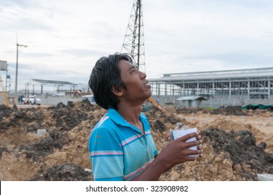 Young Man Sniffing Glue..Selective Focus. Very Shallow Depth Of Field, For Soft Background.