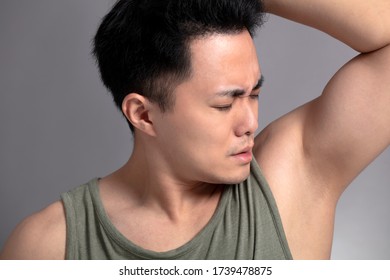  Young Man Sniffing His Armpit 