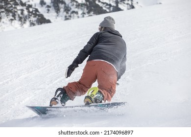 Young Man Snowboarding At The Sky Center