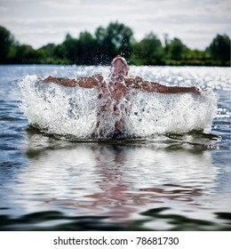 Young Man Splash Water In River