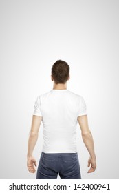 Young Man Standing Back On A White Background