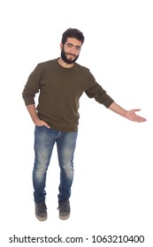 Young man standing hand in pocket and pointing with his hand invites someone to come, isolated on a white background.