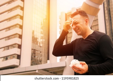 
The Young Man Standing Outside Can Not Stand The Hot Weather And High Temperature Daylight Hours In The Summer Of April In Southeast Asia.
