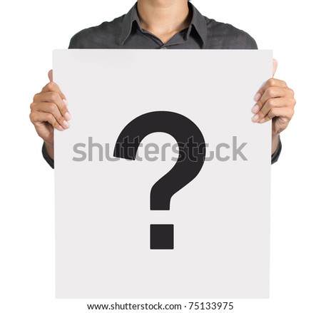 Young man standing with question mark on white board