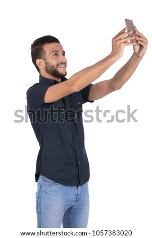 Similar – young latin man typing on his phone with emoji emoticons.