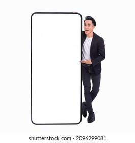Young man standing and showing big Smartphone With Blank White Screen