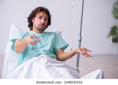 Young man staying in hospital in transfusion concept