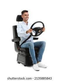 Young Man With Steering Wheel In Car Seat On White Background