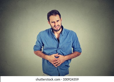 Young Man With Stomach Pain Indigestion 