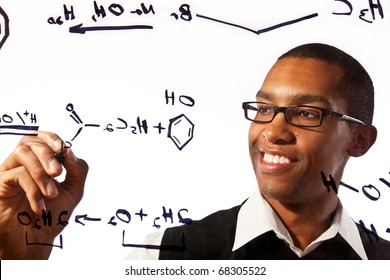 a young man studies a chemistry problem - Powered by Shutterstock