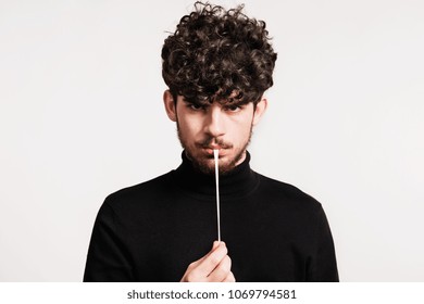 Young Man In A Studio, Pulling A Chewing Gum.