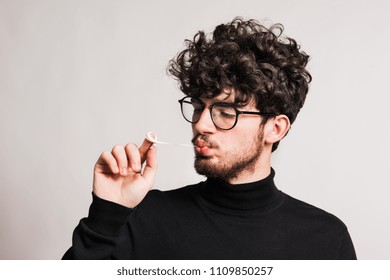 Young Man In A Studio, Pulling A Chewing Gum.